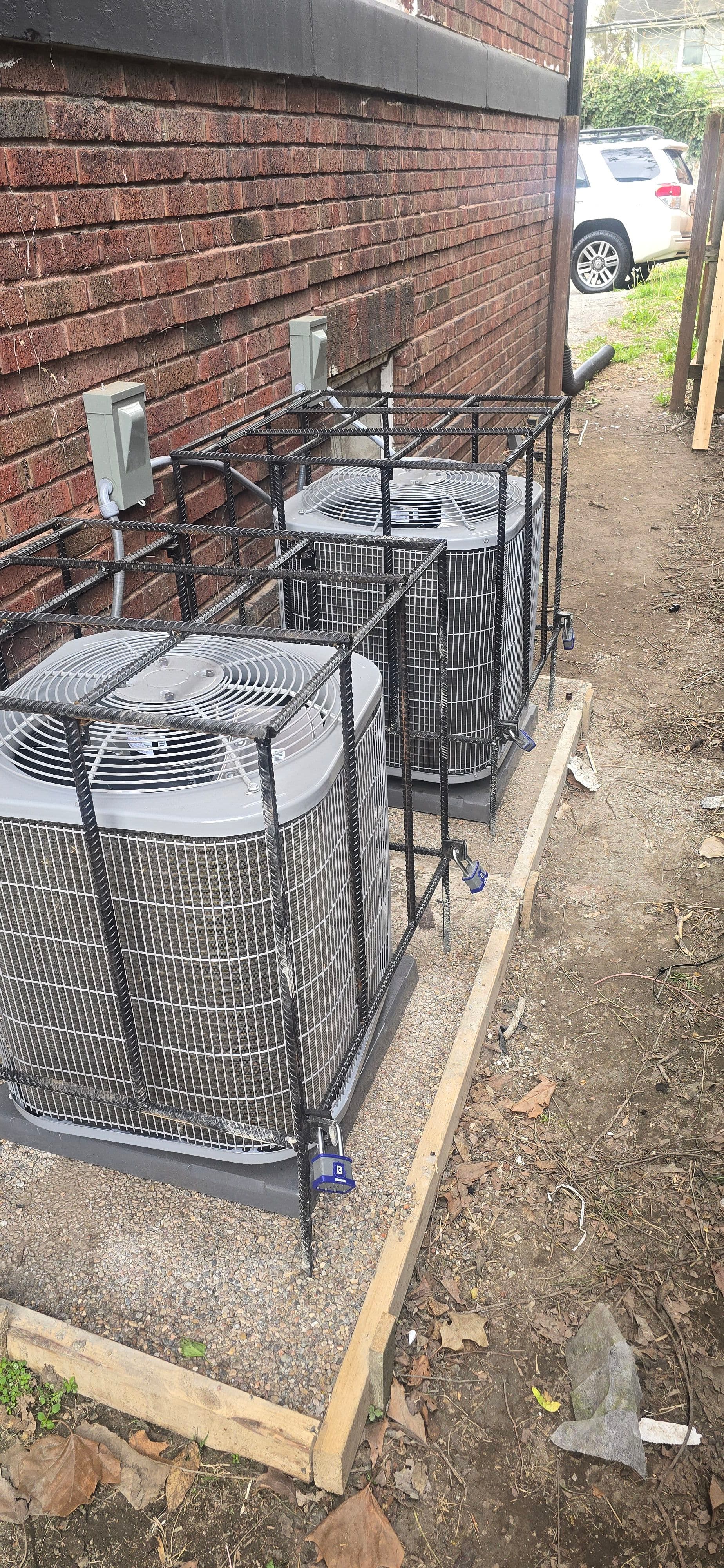 New AC Units Installed with Concrete Pads and Security Cages image